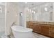 Spa-like bathroom with double vanity and soaking tub at 1810 Wisteria St, Sarasota, FL 34239