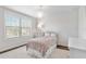 Bright bedroom with window, bedding, and a small rug at 1810 Wisteria St, Sarasota, FL 34239