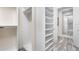 Bright walk-in closet with shelving and hanging space at 1810 Wisteria St, Sarasota, FL 34239