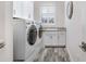 Laundry room with side-by-side washer and dryer at 1810 Wisteria St, Sarasota, FL 34239