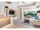 Relaxing living room with sliding doors opening to a patio and pool at 1810 Wisteria St, Sarasota, FL 34239