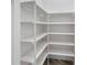 Bright walk-in pantry with ample shelving for storage at 1810 Wisteria St, Sarasota, FL 34239