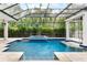 Enclosed pool area with spa and waterfall feature at 1810 Wisteria St, Sarasota, FL 34239