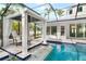 Relaxing pool and spa area with covered seating and water features at 1810 Wisteria St, Sarasota, FL 34239