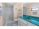 Bathroom with a teal countertop, toilet and shower at 18314 Koala Ave, Port Charlotte, FL 33948