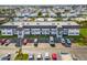 Aerial view of condo building with ample parking and surrounding community at 202 47Th Avenue W Dr # 334, Bradenton, FL 34207