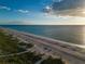 Beachfront aerial view, showing dune landscape at 20289 Benissimo Dr, Venice, FL 34293