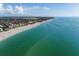 Aerial of beachfront property, showcasing homes and beach at 20289 Benissimo Dr, Venice, FL 34293