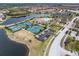 Aerial view showing community amenities including tennis courts and clubhouse at 20289 Benissimo Dr, Venice, FL 34293