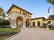 Elegant community clubhouse with arched entryways and stone detailing at 20289 Benissimo Dr, Venice, FL 34293