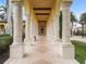 Elegant community entrance with columns and archways at 20289 Benissimo Dr, Venice, FL 34293