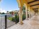 Elegant covered walkway with arches and columns overlooking the pool area at 20289 Benissimo Dr, Venice, FL 34293