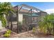 Screened-in patio with ample seating and outdoor lighting at 20289 Benissimo Dr, Venice, FL 34293