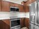 Stainless steel appliances and wood cabinets at 20289 Benissimo Dr, Venice, FL 34293