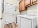 Laundry room with washer, dryer, and storage at 20289 Benissimo Dr, Venice, FL 34293