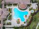 Top-down view of a freeform pool and adjacent clubhouse at 20289 Benissimo Dr, Venice, FL 34293