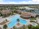 Luxury resort-style pool with surrounding lounge chairs and landscaping at 20289 Benissimo Dr, Venice, FL 34293