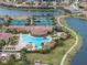 Aerial view of a large, resort-style pool with surrounding amenities at 20289 Benissimo Dr, Venice, FL 34293