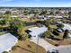 Aerial view of single-story home on waterfront lot with canal access at 207 Waterway Ne Cir, Port Charlotte, FL 33952