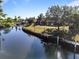 Aerial view of waterfront home with private dock and spacious backyard at 207 Waterway Ne Cir, Port Charlotte, FL 33952