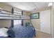 Bedroom with a bunk bed and window at 207 Waterway Ne Cir, Port Charlotte, FL 33952