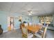 Bright dining room featuring a wood table and six chairs at 207 Waterway Ne Cir, Port Charlotte, FL 33952