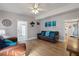 Living room with brown leather couches, wood floors, and a TV at 207 Waterway Ne Cir, Port Charlotte, FL 33952