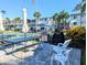 Outdoor kitchen with gas grill and picnic tables at 2075 Canal Dr # L36, Bradenton, FL 34207