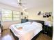 Spacious bedroom with king-size bed and ceiling fan at 2075 Canal Dr # L36, Bradenton, FL 34207