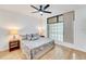 Bright bedroom featuring a king bed and large window at 2110 Harbourside Dr # 526, Longboat Key, FL 34228