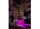 Lush courtyard with a central fountain at night at 2110 Harbourside Dr # 526, Longboat Key, FL 34228