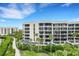 Modern condo building with water access and walkway at 2110 Harbourside Dr # 526, Longboat Key, FL 34228