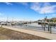 Calm marina with many boats and waterfront walkway at 2110 Harbourside Dr # 526, Longboat Key, FL 34228