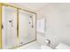 Large walk-in shower with glass enclosure and gold fixtures at 2110 Harbourside Dr # 526, Longboat Key, FL 34228