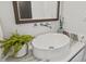 Elegant bathroom featuring a round vessel sink, marble countertop, and modern faucet at 2138 Floyd St, Sarasota, FL 34239