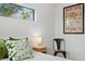 Bedroom with nightstand and green pillows at 2138 Floyd St, Sarasota, FL 34239