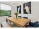 Bright dining room with wood table and blue chairs at 2138 Floyd St, Sarasota, FL 34239