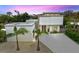 Modern two-story home with a flat roof, featuring a clean, minimalist design and a spacious driveway at 2138 Floyd St, Sarasota, FL 34239