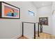 Hallway with modern railing and artwork at 2138 Floyd St, Sarasota, FL 34239