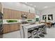 Bright, modern kitchen featuring quartz countertops, stainless appliances, and a stylish island with seating at 2138 Floyd St, Sarasota, FL 34239