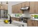 Modern kitchen with gas range and custom cabinetry at 2138 Floyd St, Sarasota, FL 34239