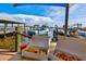 Scenic waterfront dining view with fresh seafood, a quaint pier, and boats against a blue sky at 2138 Floyd St, Sarasota, FL 34239