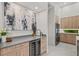 Modern wet bar with wine cooler and sleek grey countertop at 2138 Floyd St, Sarasota, FL 34239