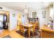 View of dining room from kitchen, featuring hardwood floors and a table for four at 255 The Esplanade N # 506, Venice, FL 34285