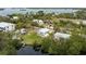 Aerial view of a house with a large yard and canal access at 29 Mound, Terra Ceia, FL 34250