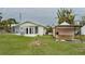 Large backyard with shed and grassy area at 29 Mound, Terra Ceia, FL 34250