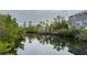 Scenic view of a canal with lush vegetation and waterfront homes at 29 Mound, Terra Ceia, FL 34250