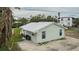 Quaint light green house with metal roof and small yard at 29 Mound, Terra Ceia, FL 34250