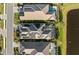 Top-down view of homes with solar panels and pools at 328 Aria Dr, Nokomis, FL 34275