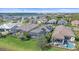 Aerial view of community featuring tile roofs, screened in pools, and a lake at 328 Aria Dr, Nokomis, FL 34275